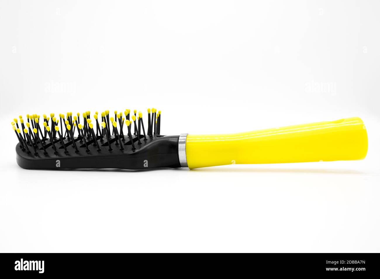Black plastic comb with a yellow handle Stock Photo Alamy