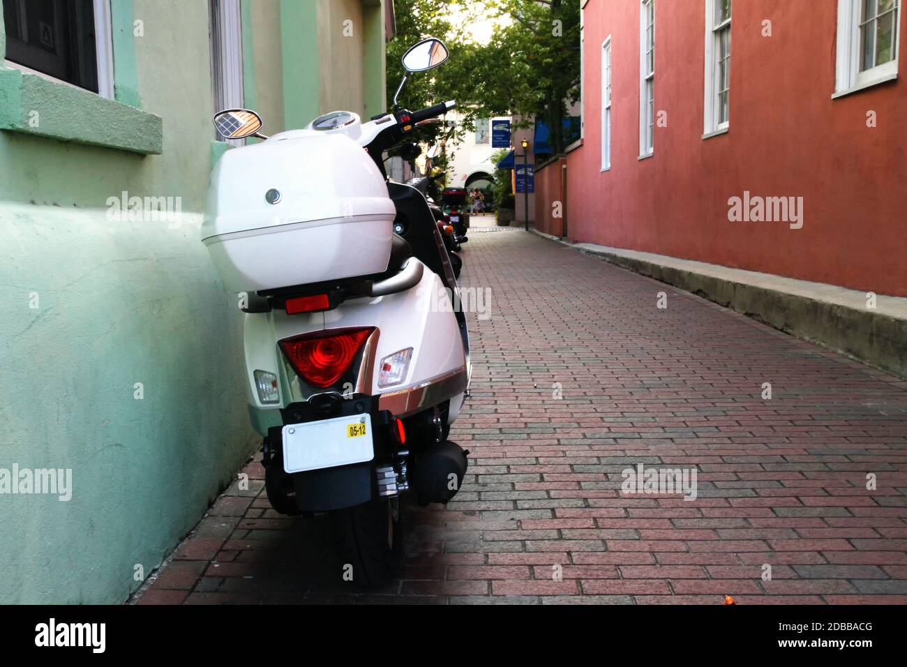 A parked moped in an alley in St. Augustine, Florida Stock Photo Alamy