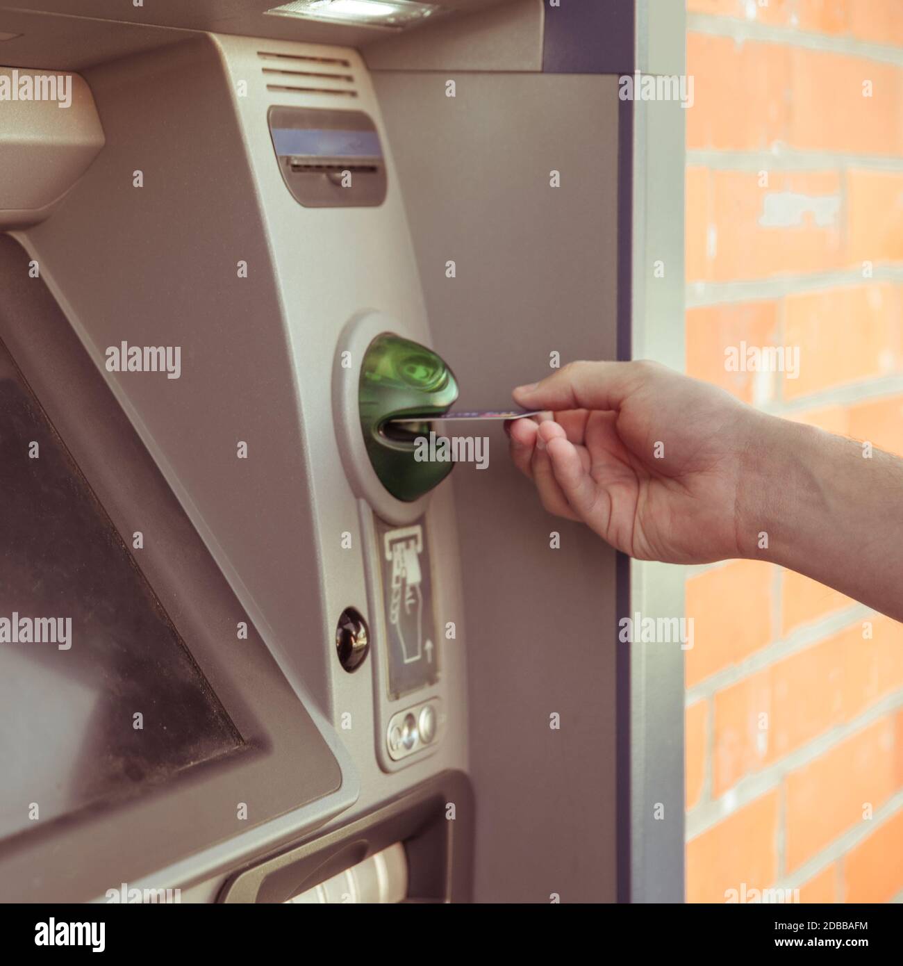 use the card at an ATM to withdraw cash. Stock Photo