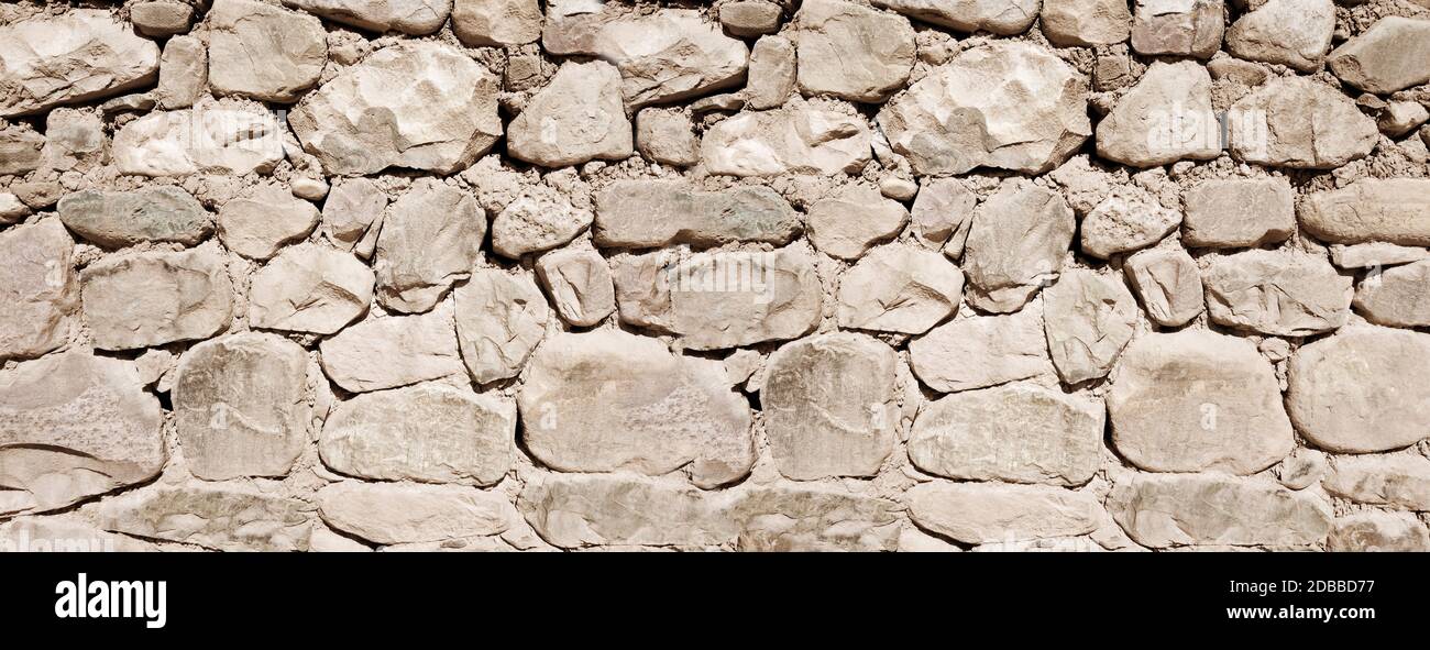 Old rough stone wall, banner background wallpaper Stock Photo - Alamy