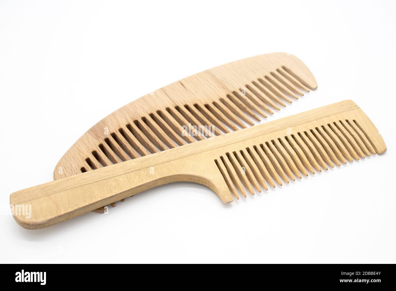 Wooden comb with handle on white background Stock Photo Alamy