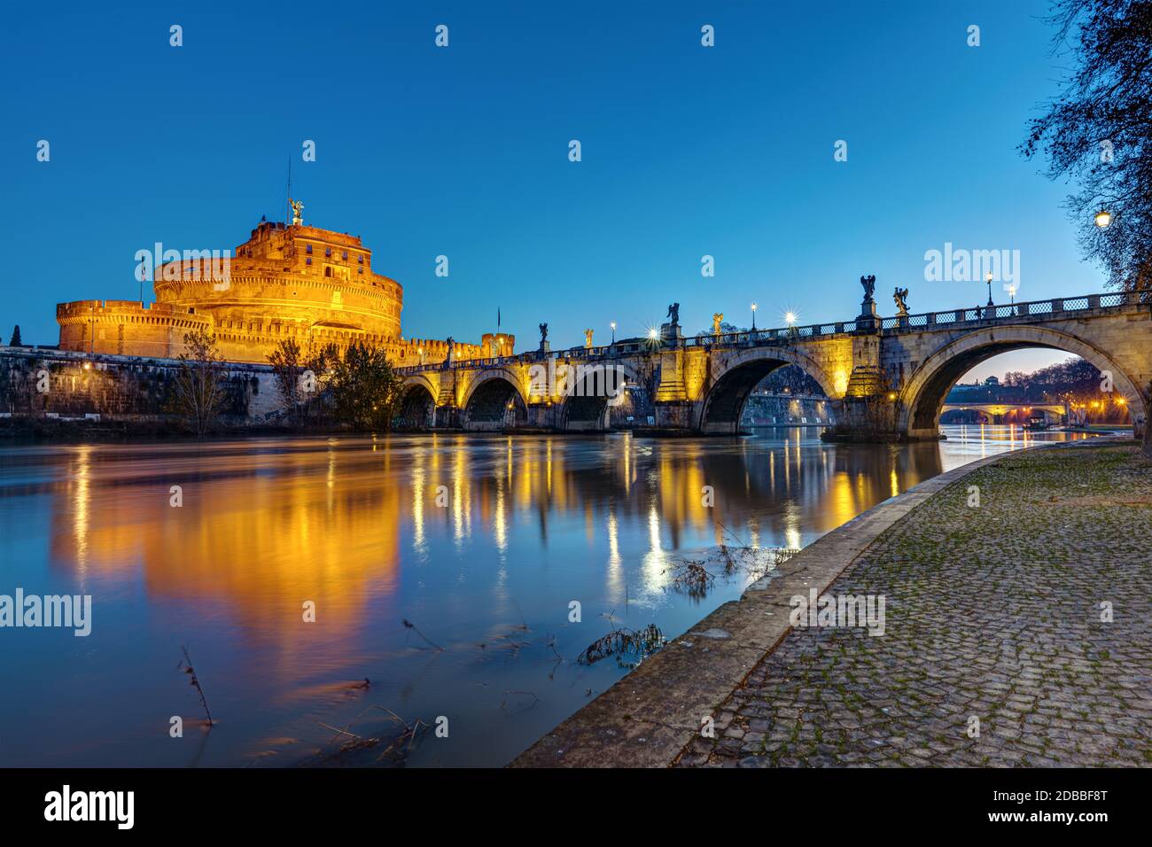 The Castel Sant Angelo and the Sant Angelo bridge in Rome at twilight Stock Photo