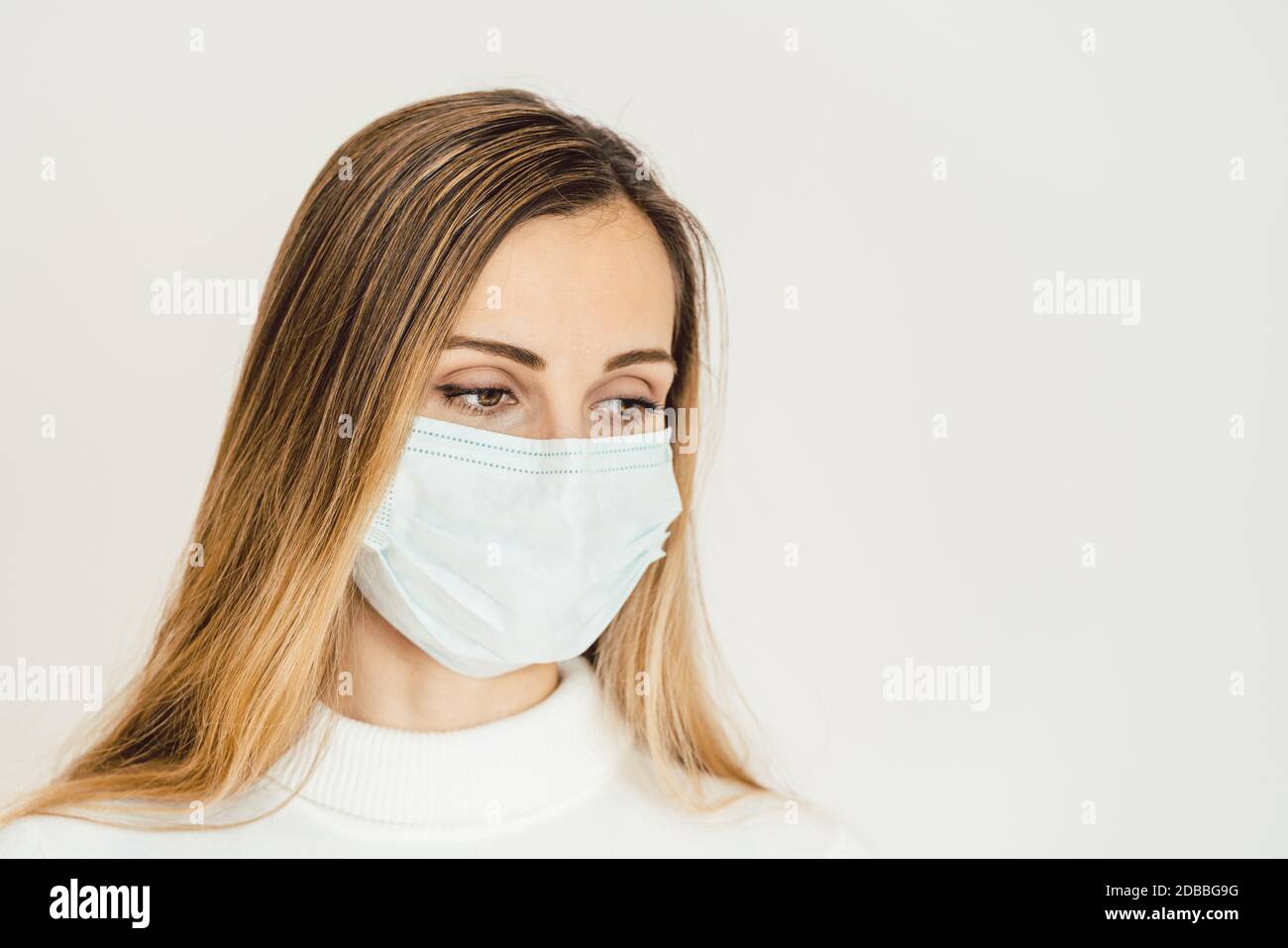 Woman contemplating what lies ahead during Coronavirus crisis being worried Stock Photo