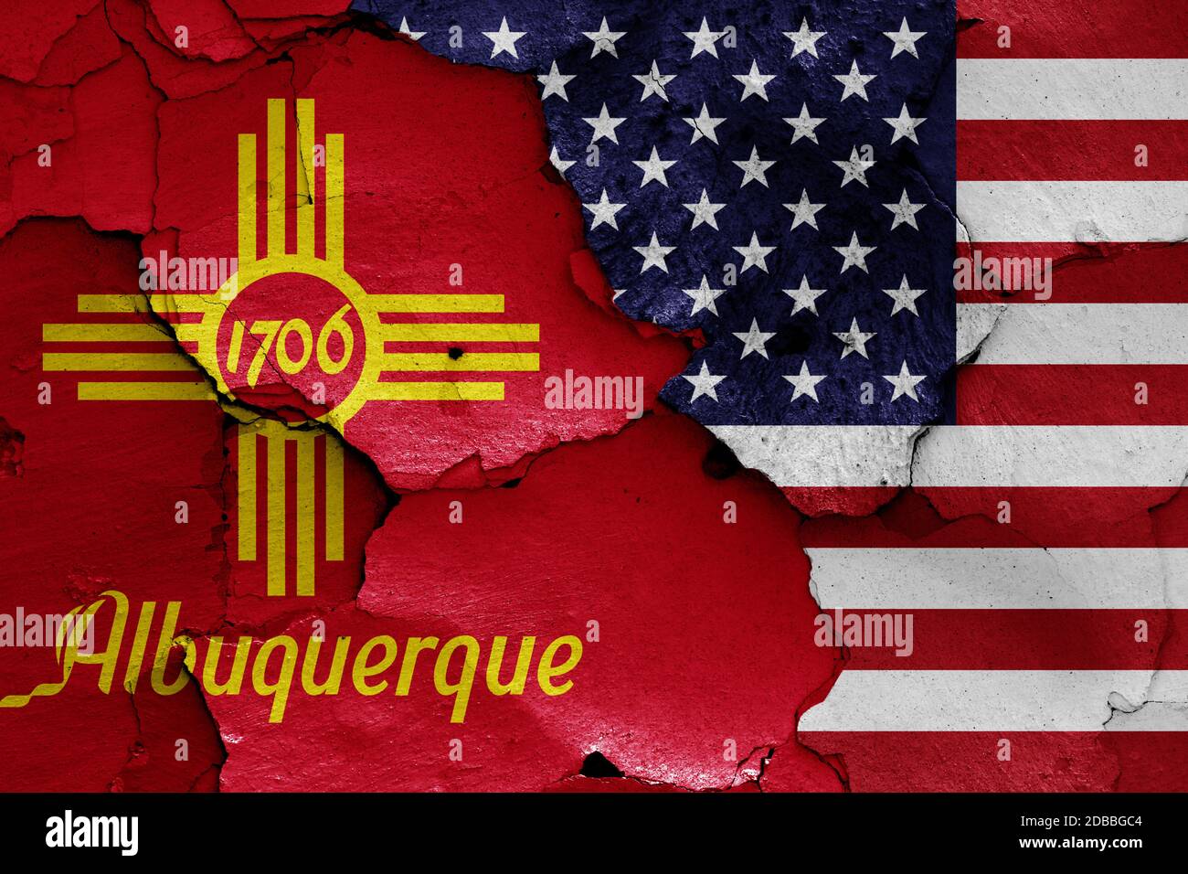 flags of Albuquerque and USA painted on cracked wall Stock Photo