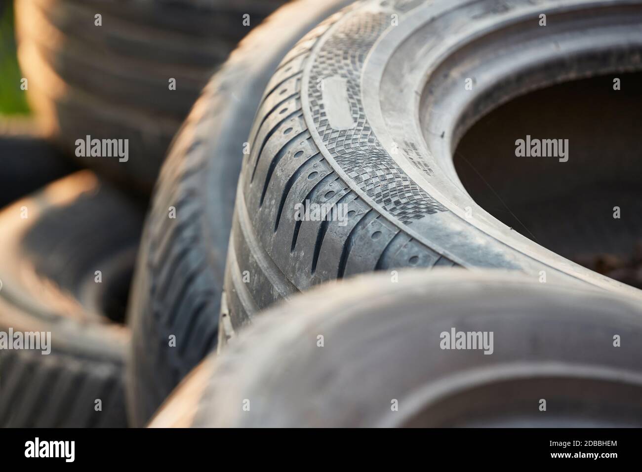 Old tyres in a waste pile got rid of by illegal dumping Stock Photo Alamy