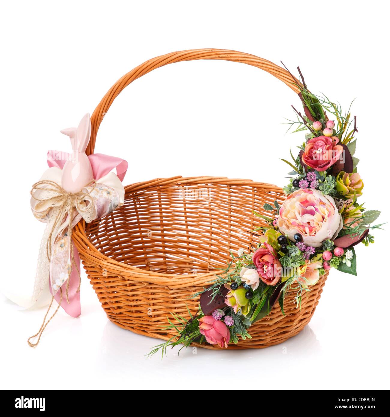 Wicker basket decorated with flowers on white background. Isolated ...