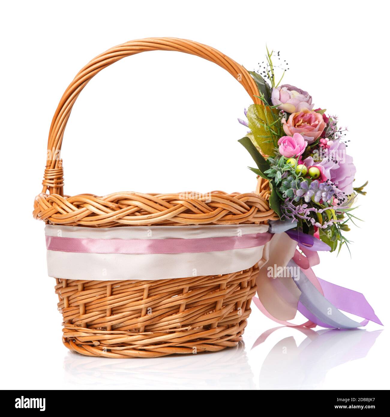 Wicker basket decorated with flowers on white background. Isolated ...