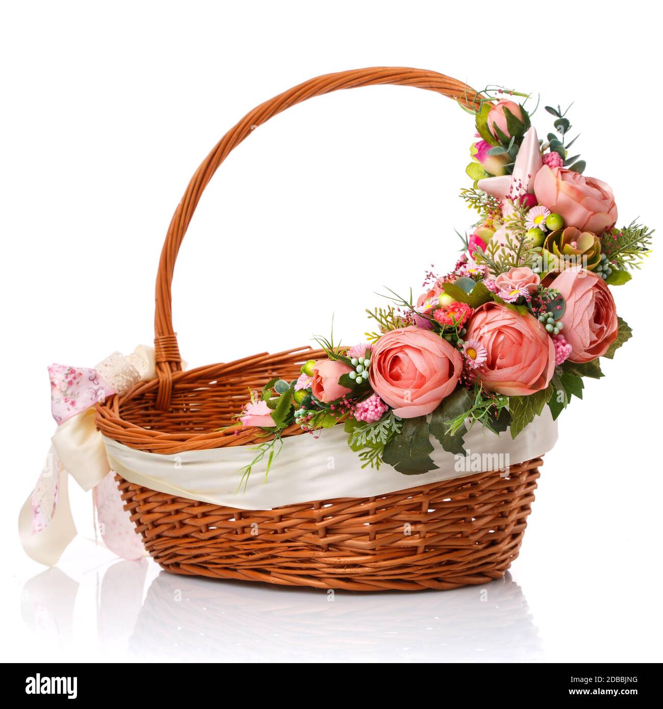 Wicker basket decorated with flowers on white background. Isolated ...