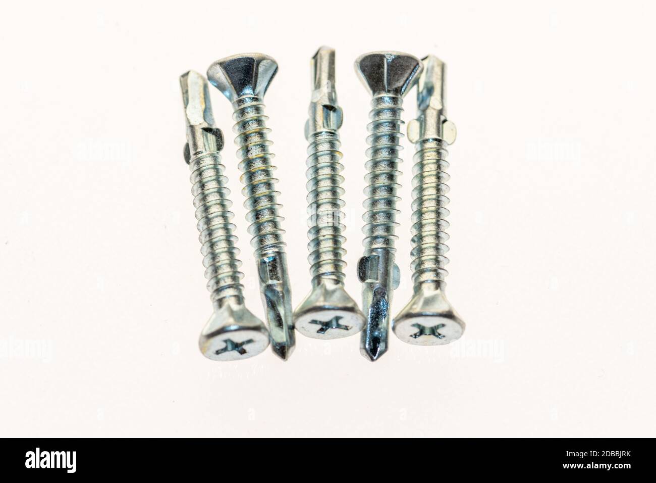 sheet metal and stainless steel screws together with hex nuts Stock