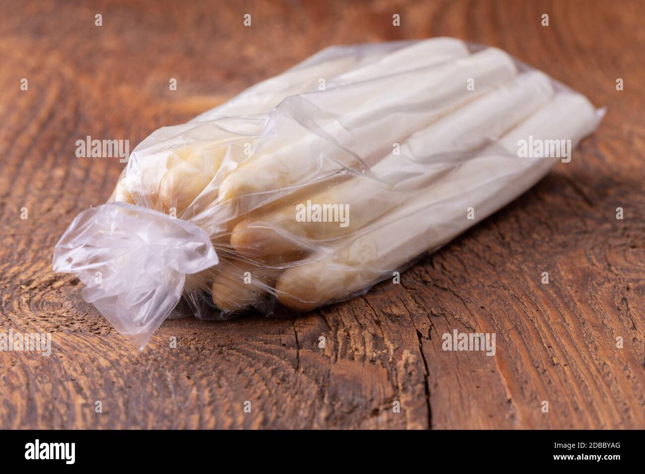 bunch of white asparagus on wood Stock Photo