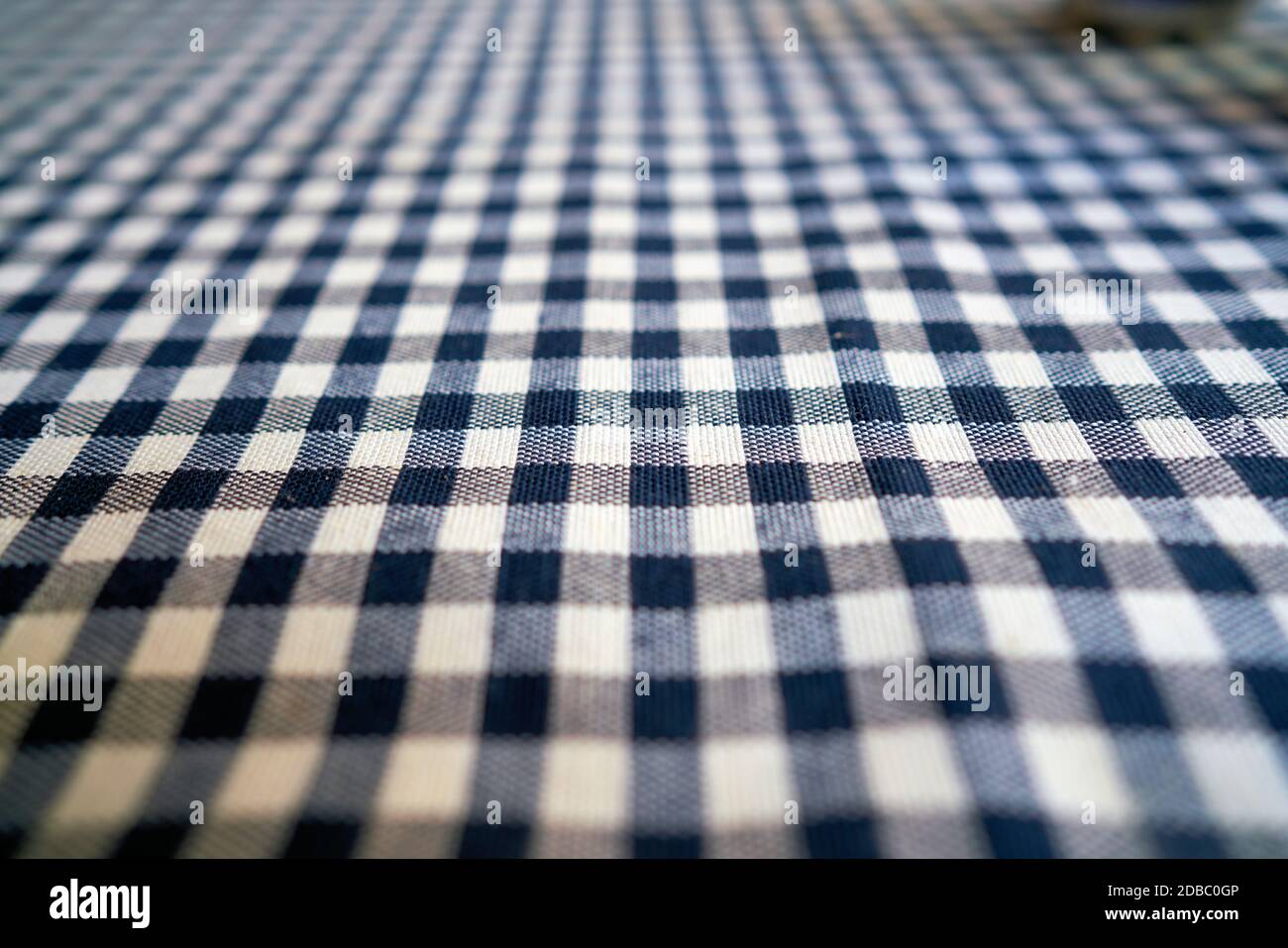 Checked tablecloth on a table in a restaurant Stock Photo