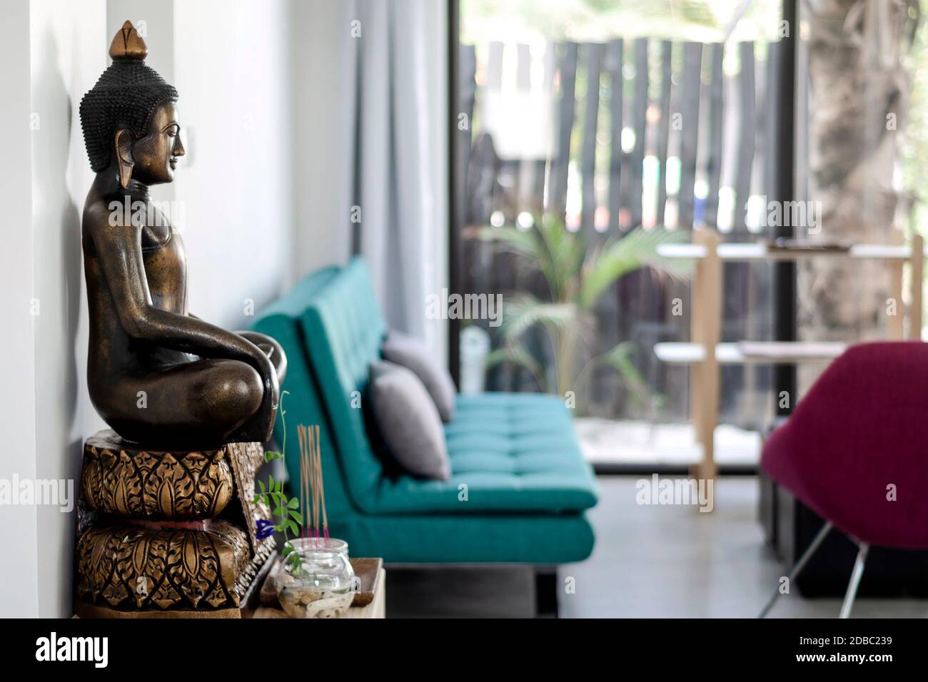 bronze buddha statue interior design detail in modern asian home living