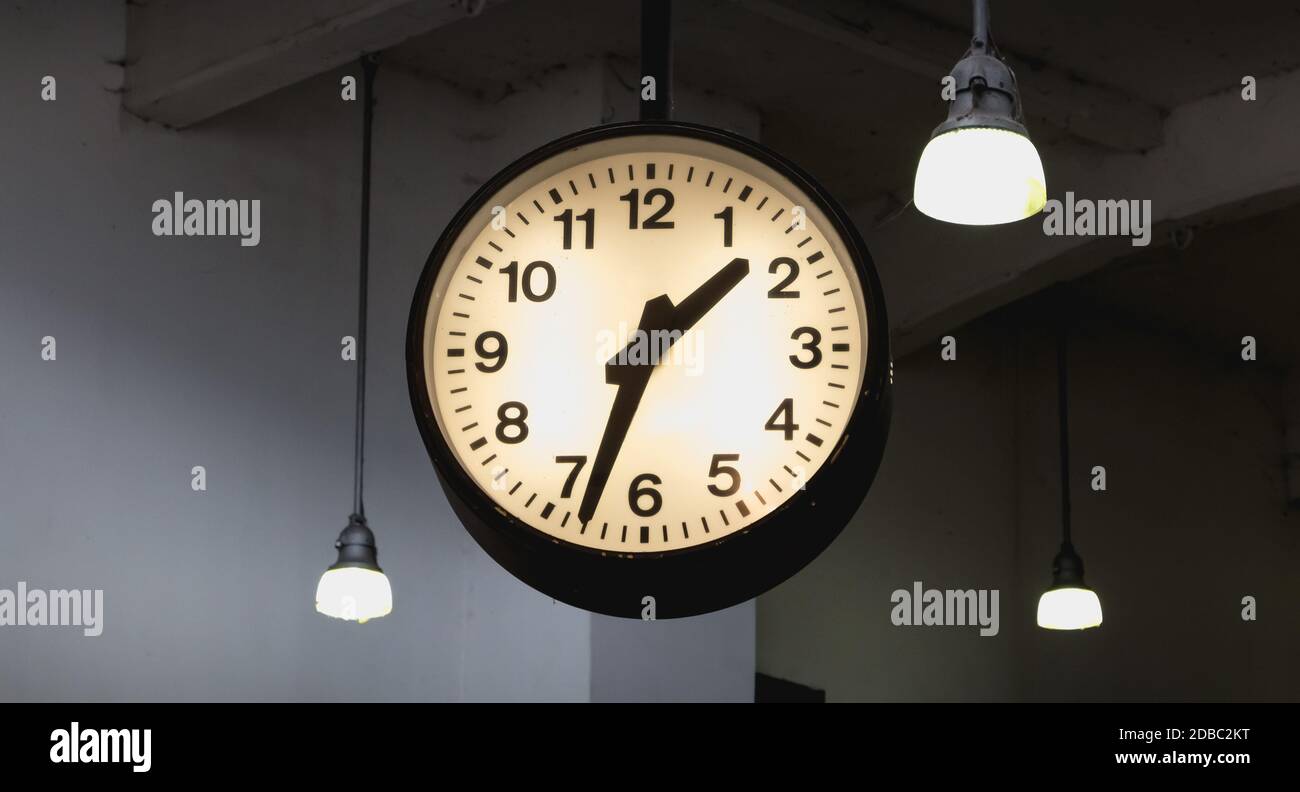 Como, Italy - November 4, 2017: cable car station clock showing 1h33 in the city center on a fall day Stock Photo