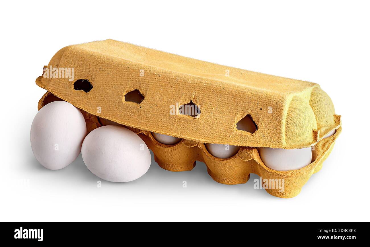 Closed cardboard egg tray and two eggs in front isolated on white