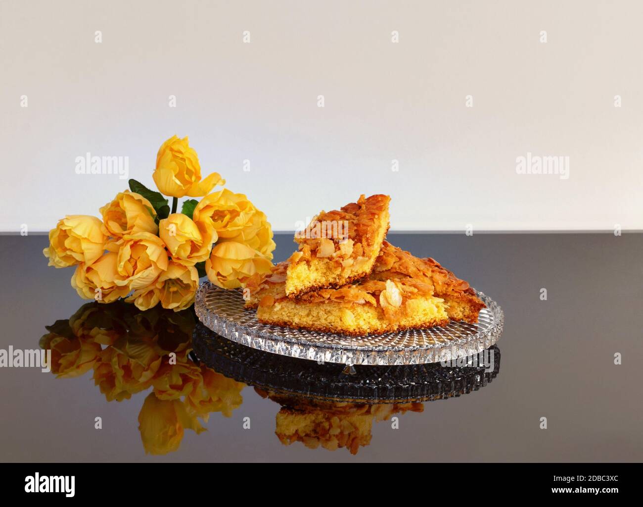 Homemade almond cake is reflected on a plate. Stock Photo