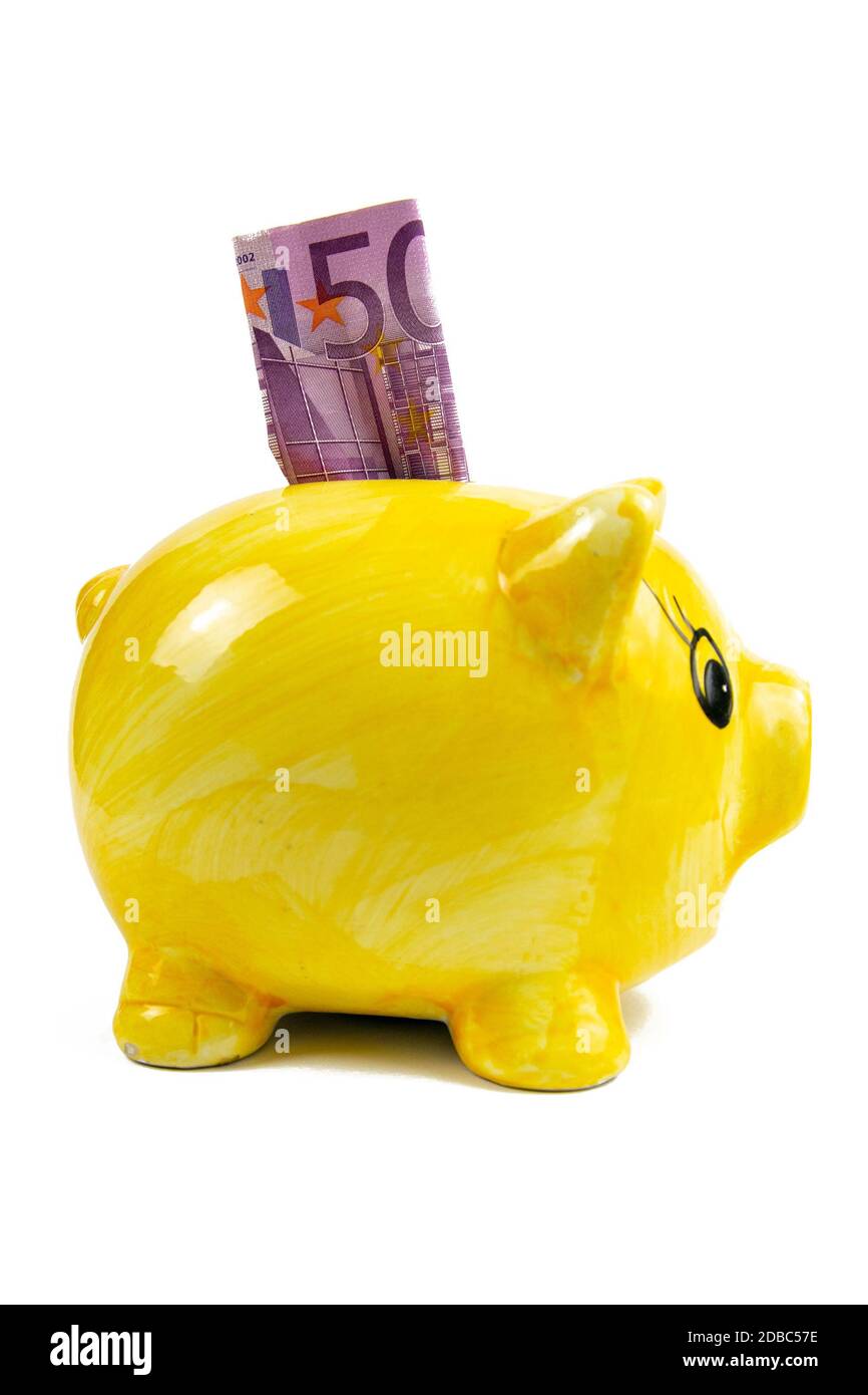 500 euros put in piggy bank isolated on white background. Stock Photo
