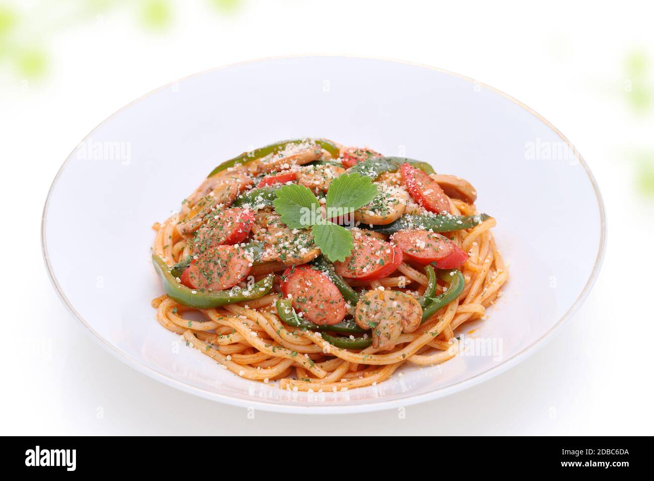 Japanese Naporitan spaghetti with tomato sauce in a dish on white background Stock Photo