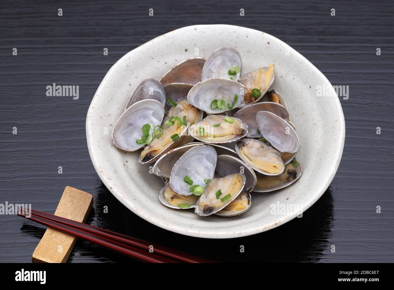 Japanese traditional cuisine, Sake steamed clams, Sakamushi, on table Stock Photo