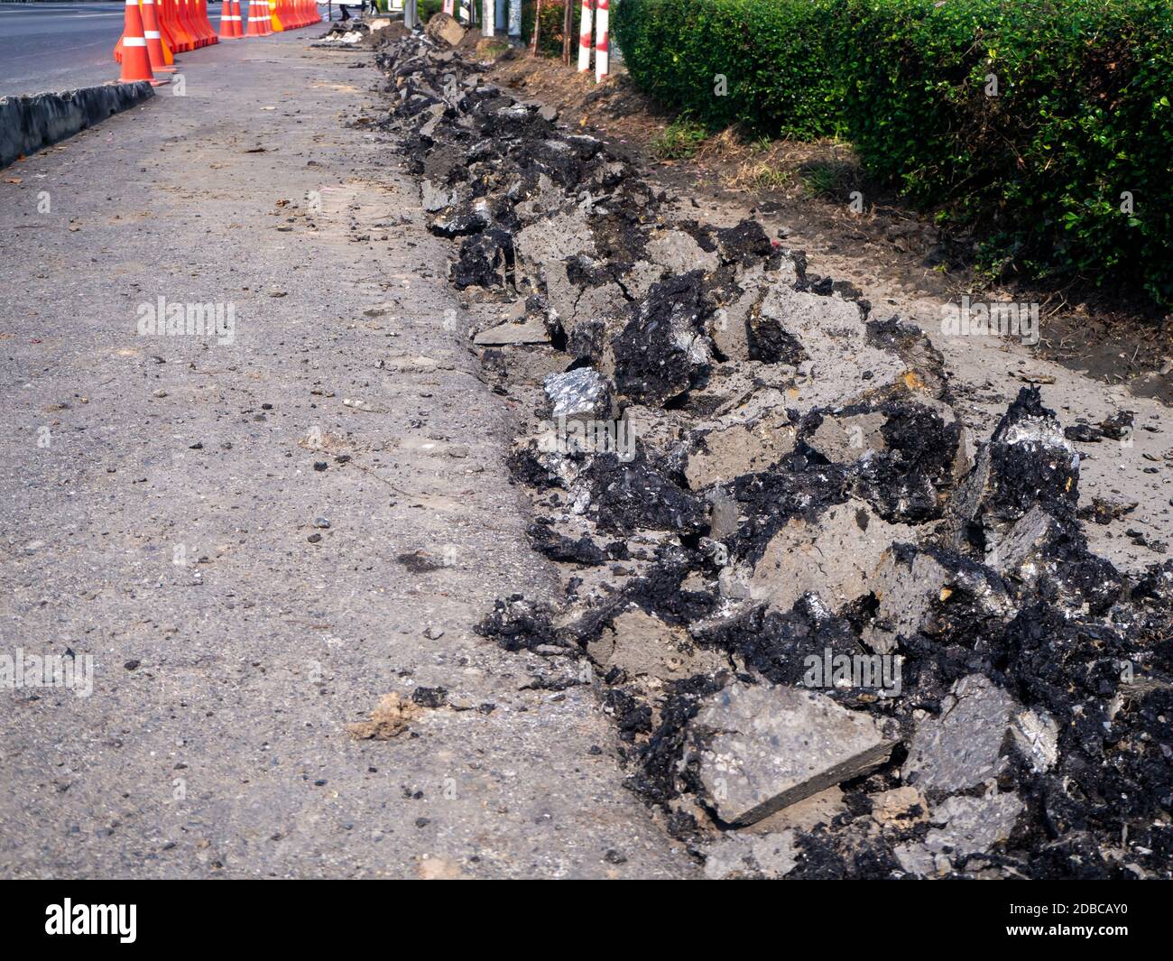 the Road repairing works with jackhammer. machine drills asphalt Stock Photo