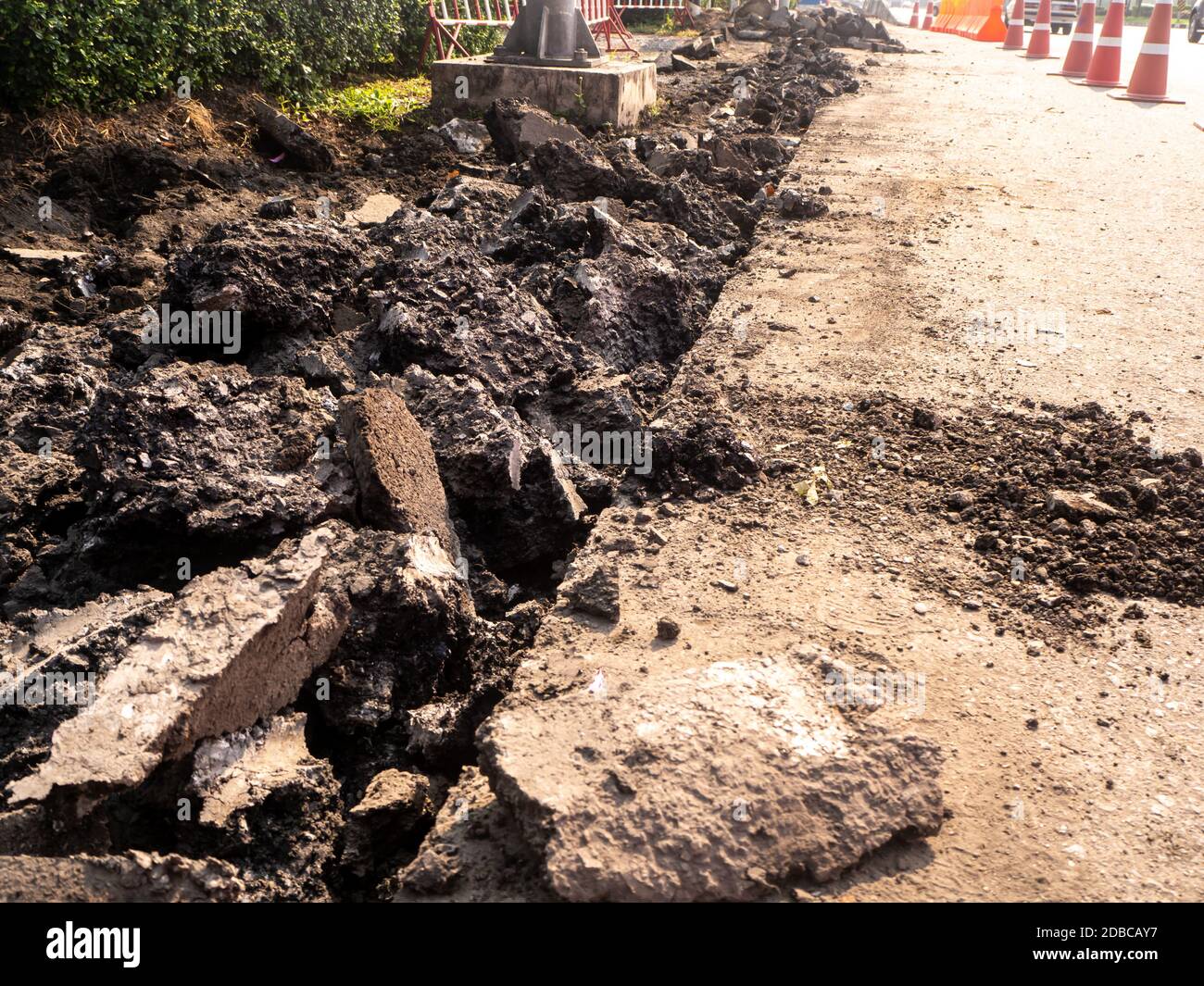the Road repairing works with jackhammer. machine drills asphalt Stock Photo