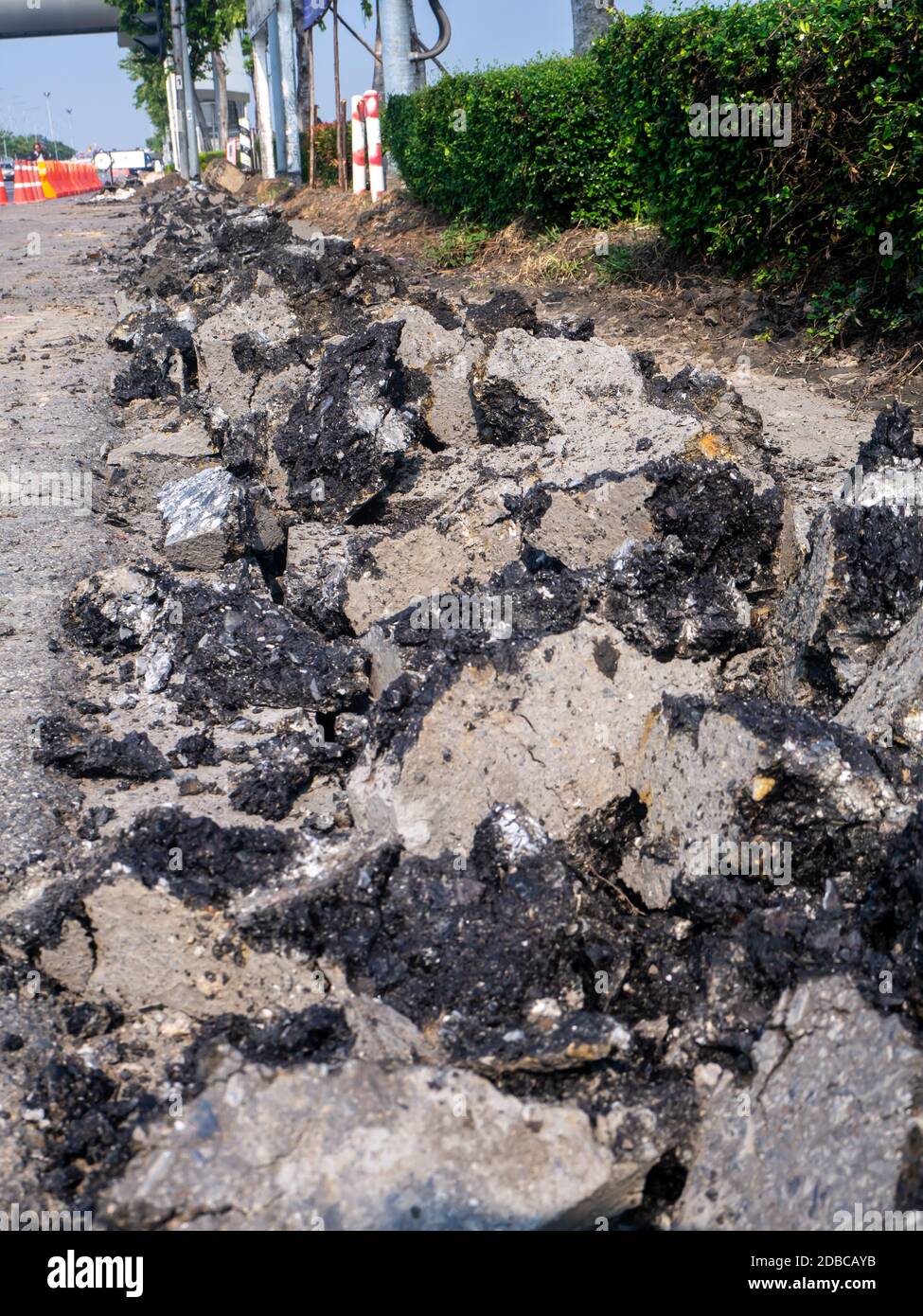 the Road repairing works with jackhammer. machine drills asphalt Stock Photo