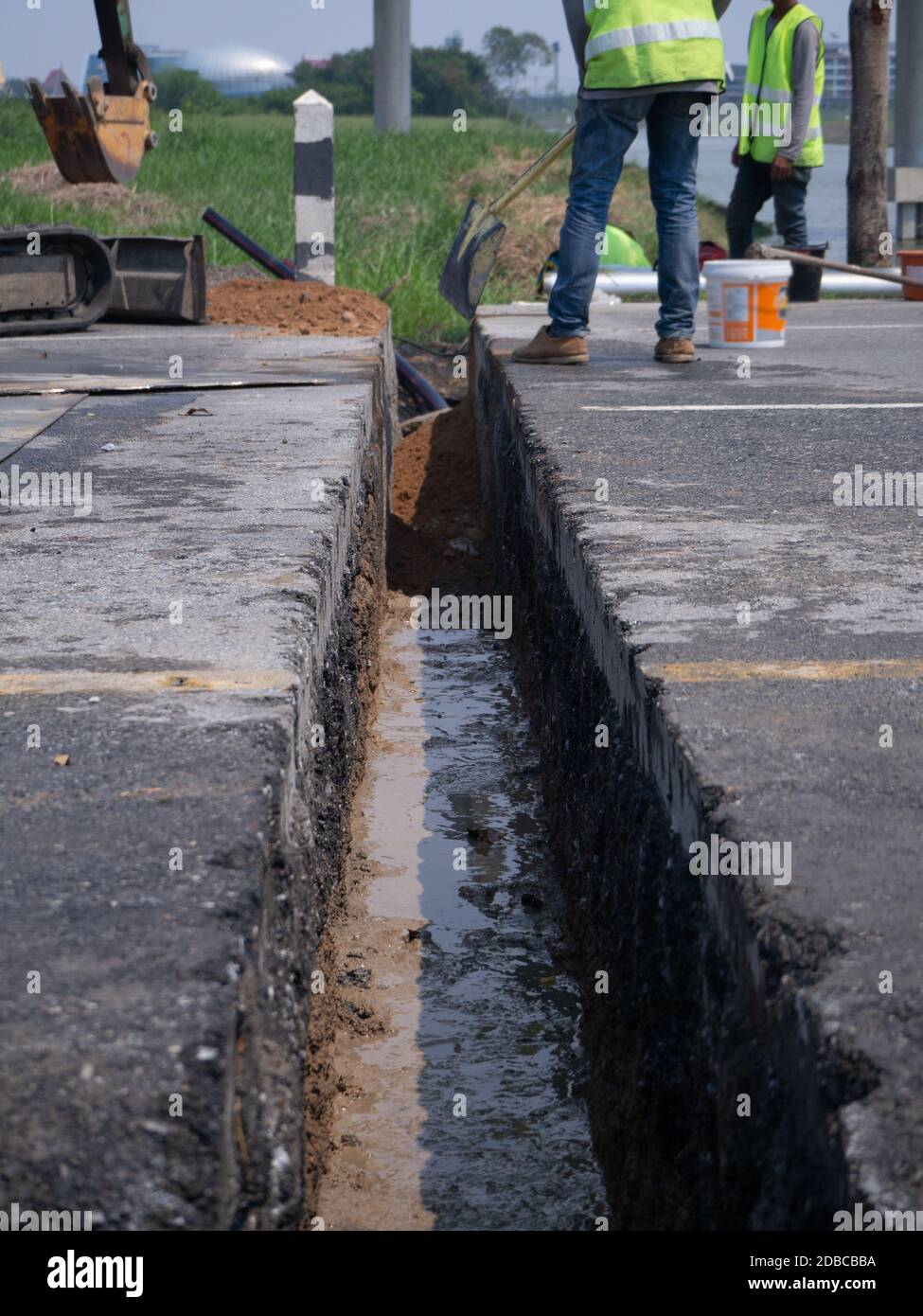 installing concrete drains on the side of the road Stock Photo Alamy