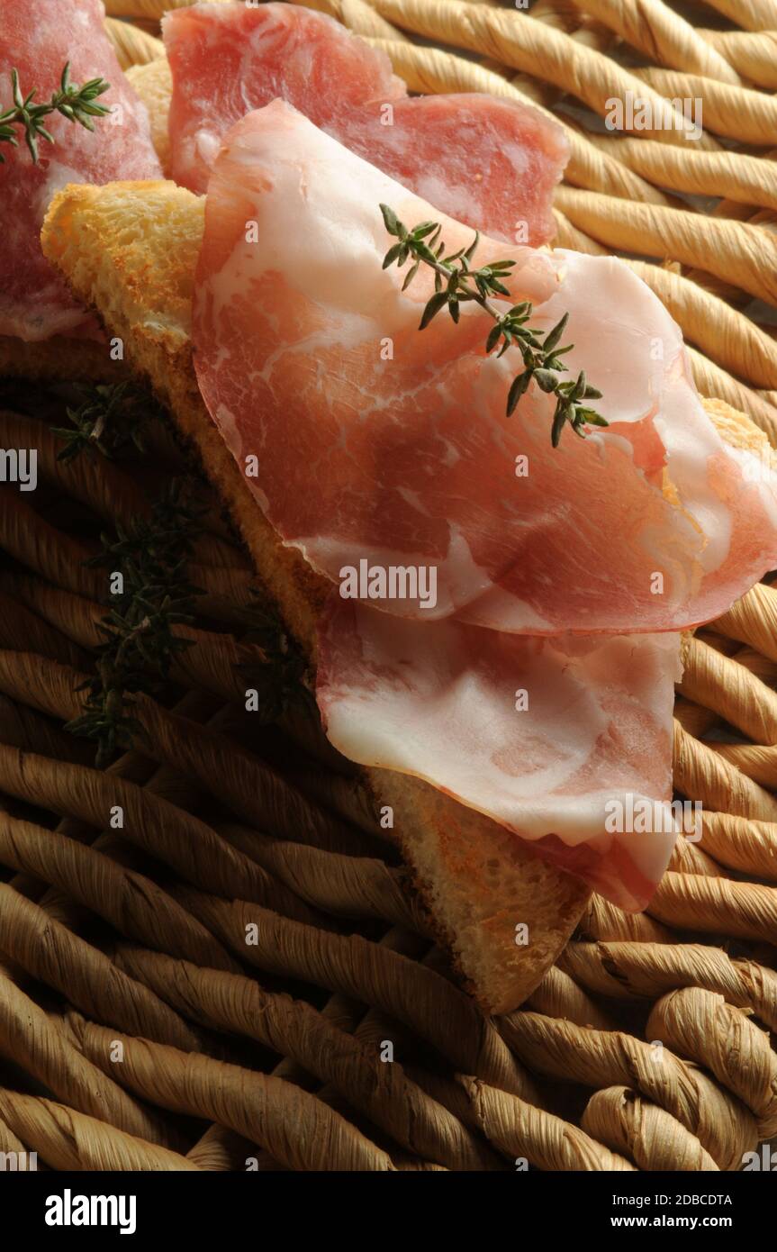 Mixed cold cuts on the bread Stock Photo