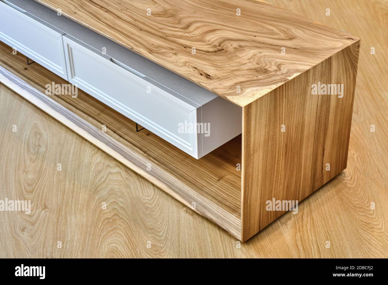 Live edge elm slab media cabinet in contemporary living room. Modern furniture close-up Stock Photo