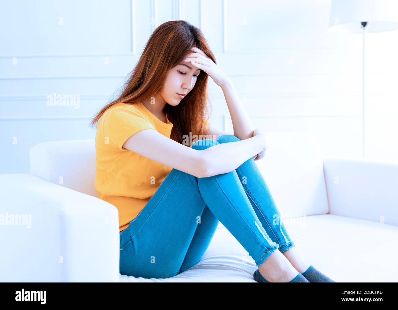 Sad woman feeling upset indoor hi-res stock photography and images - Alamy