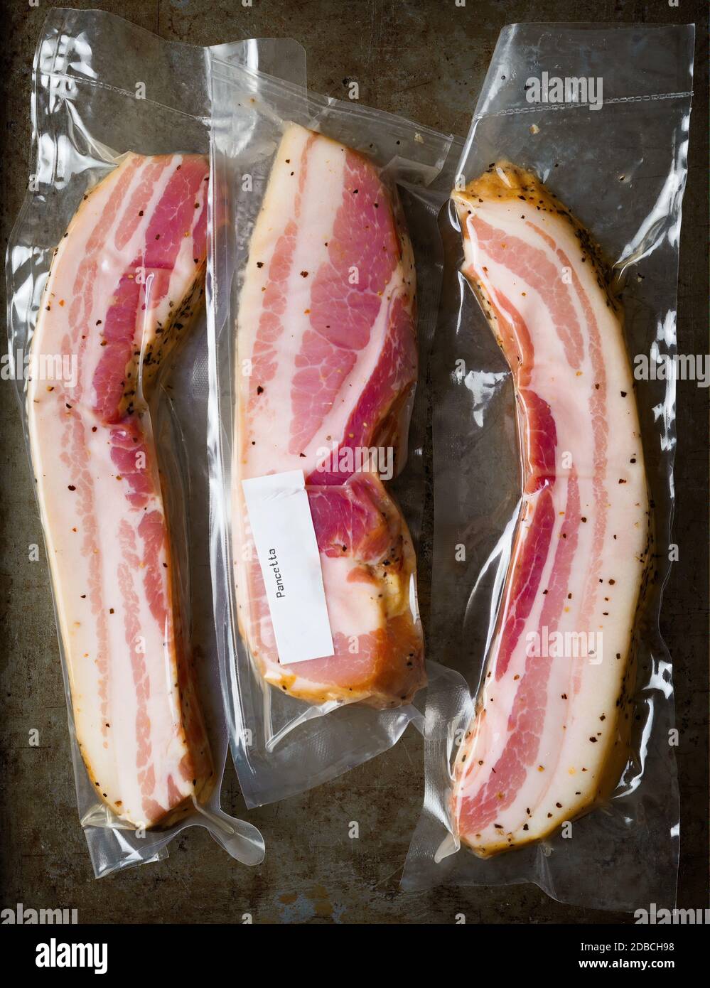 https://c8.alamy.com/comp/2DBCH98/close-up-of-rustic-italian-pancetta-bacon-in-plastic-packaging-2DBCH98.jpg