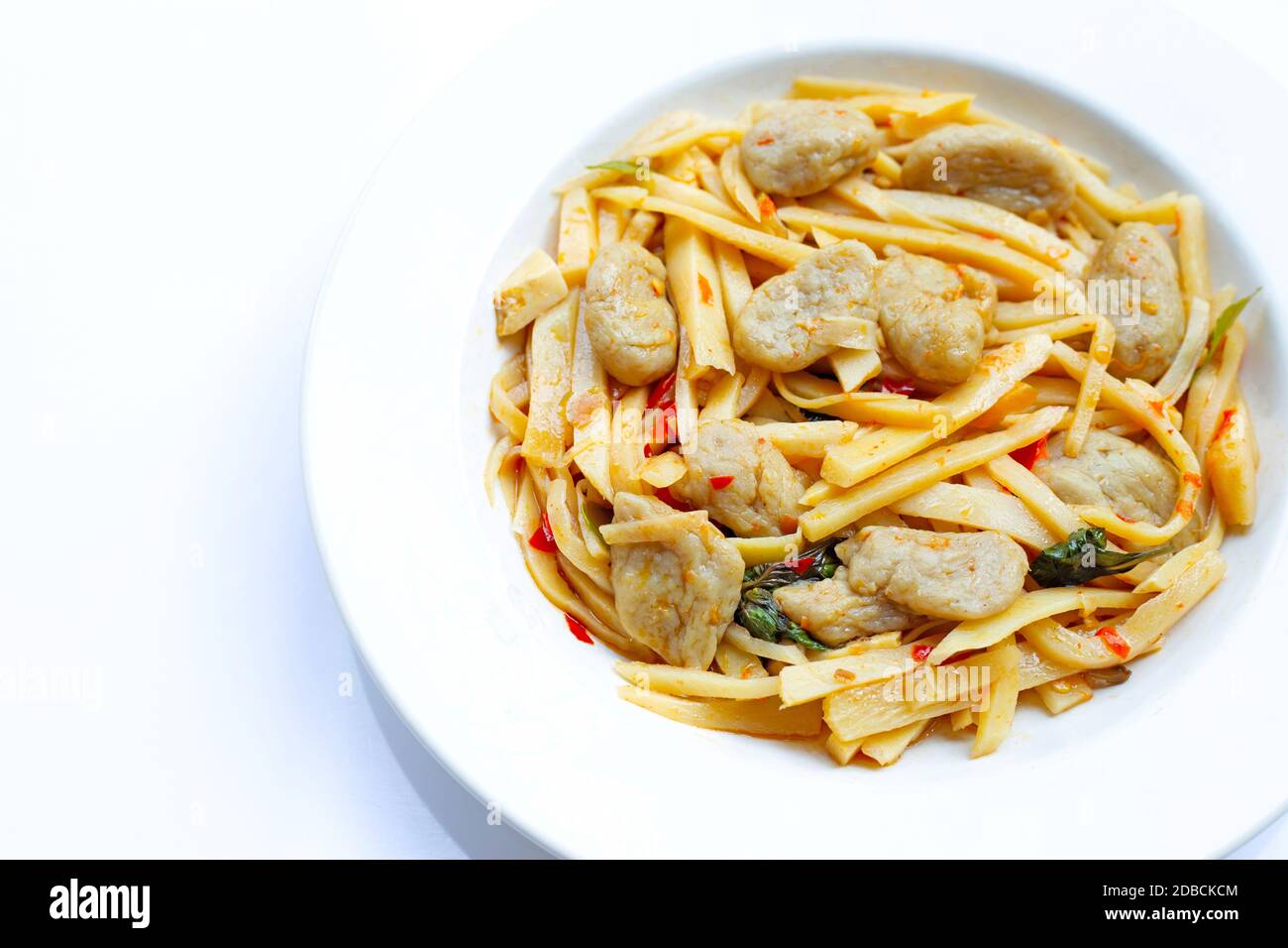 Spicy preserved bamboo shoot stir fried recipe with fish ball on white