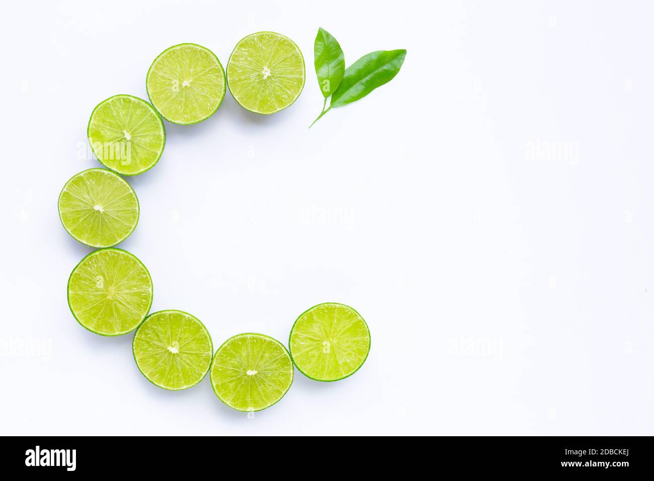 High vitamin C, Letter C made of limes with leaves isolated on white