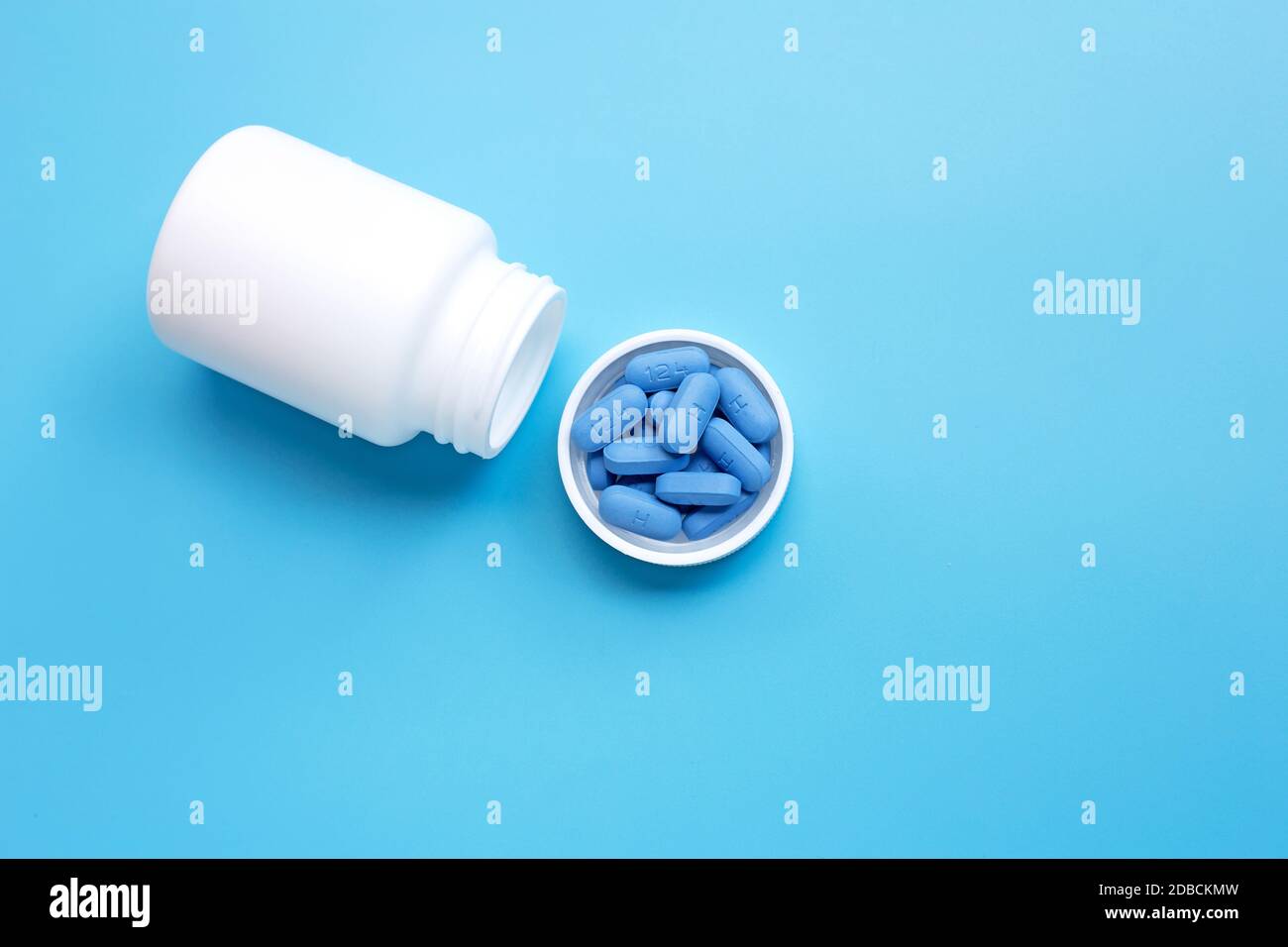 https://c8.alamy.com/comp/2DBCKMW/prep-pre-exposure-prophylaxis-used-to-prevent-hiv-in-plastic-pill-bottle-cap-on-blue-background-copy-space-2DBCKMW.jpg