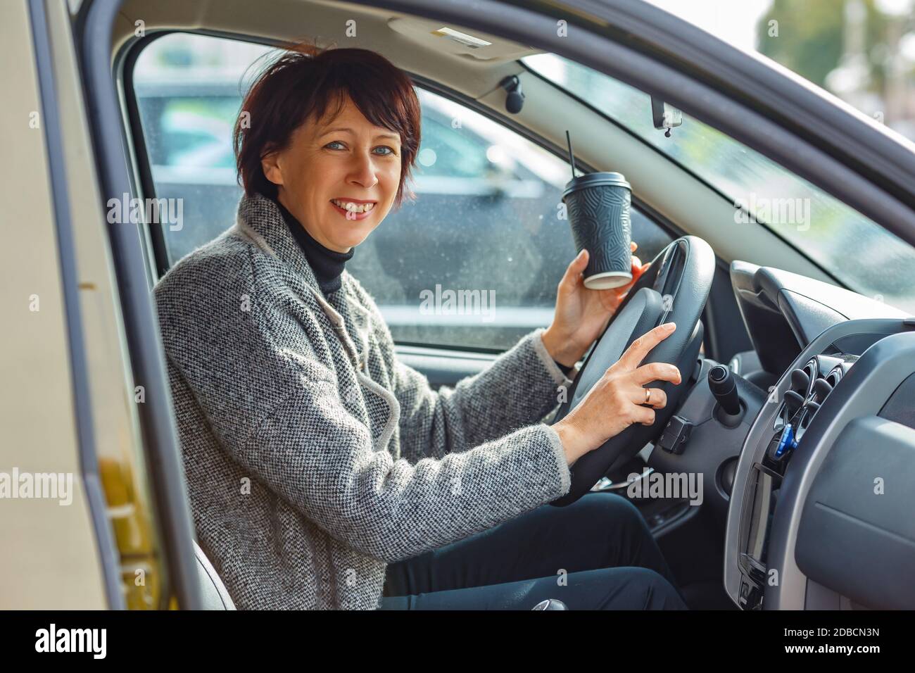 Portrait of a woman driving a car. Learning to drive Stock Photo