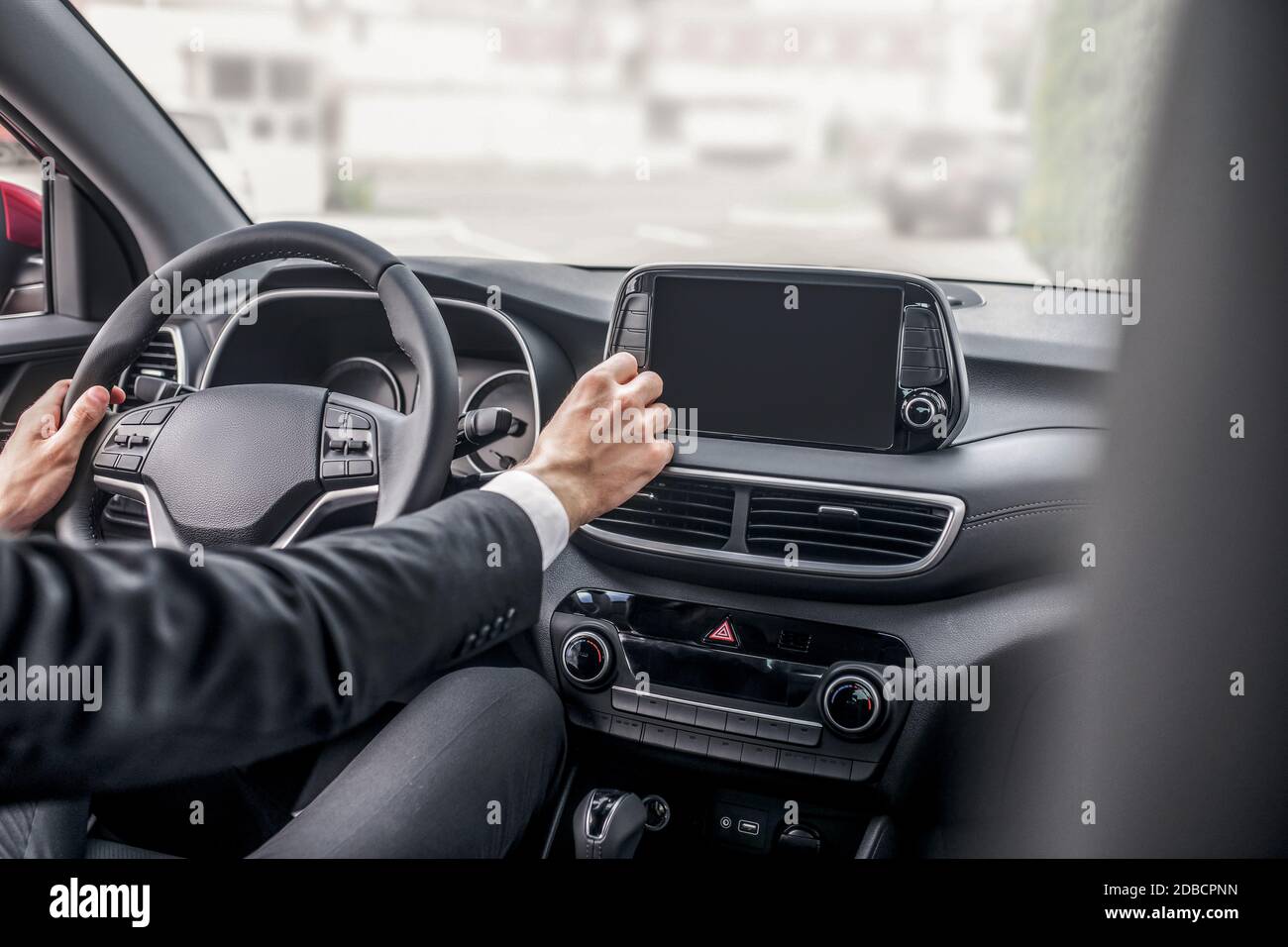 Rear view of male hands adjusting car settings Stock Photo Alamy