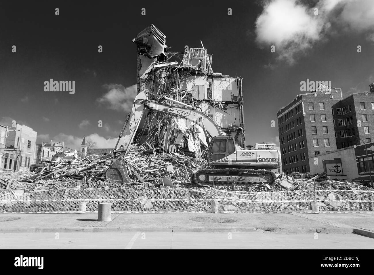 Demolition workers tear down the Tama Building in Burlington, Iowa. In