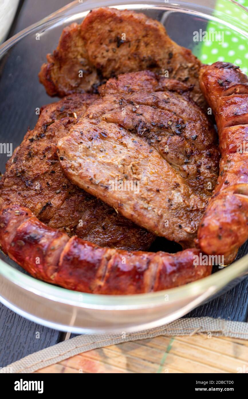 Unhealthy but tasty grilled sausages and meat Stock Photo Alamy
