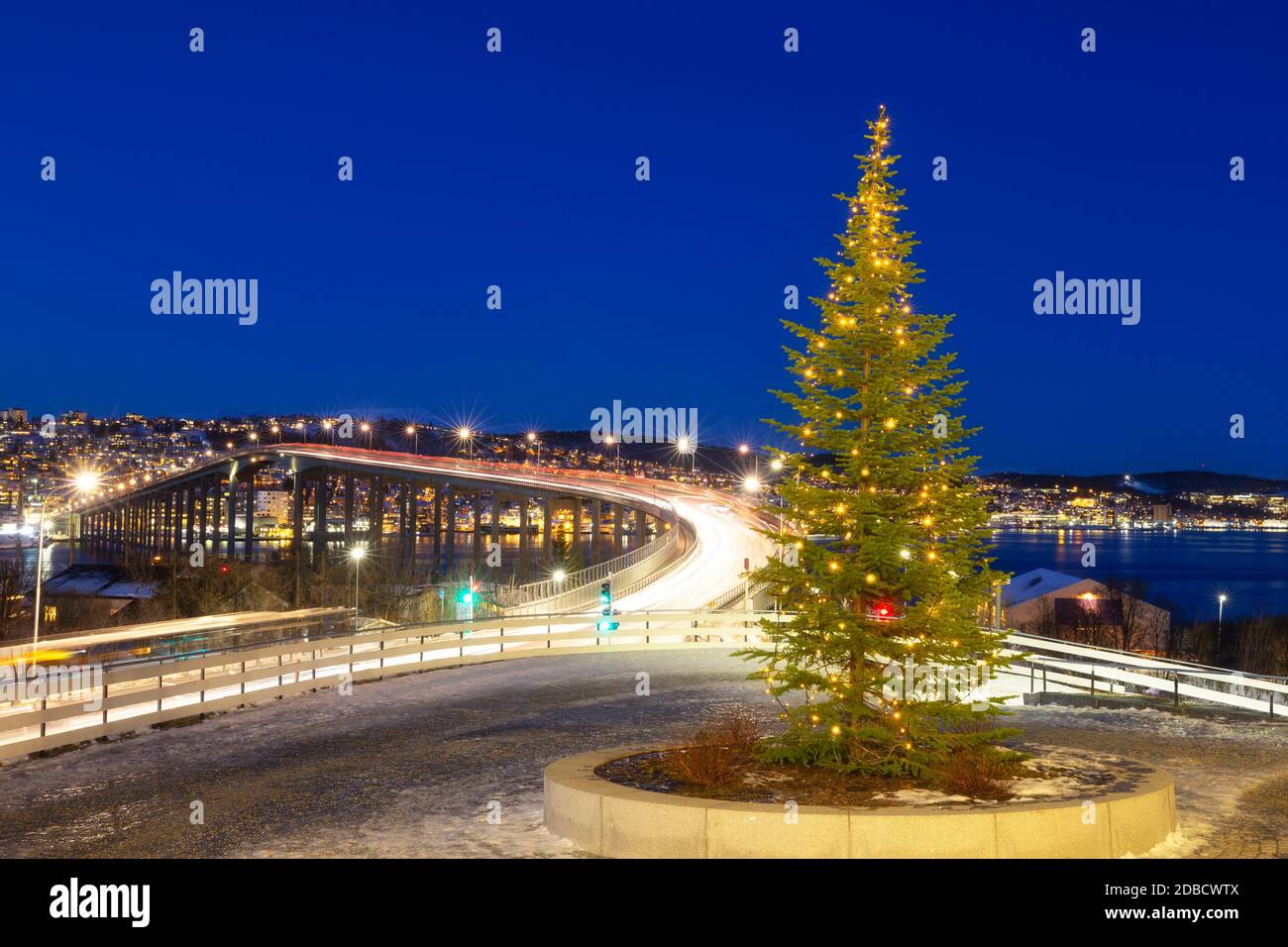 Christmas Tree Near Bridge Of Tromso,  Norway,  Tromso At Winter Time, Christmas in Tromso Stock Photo