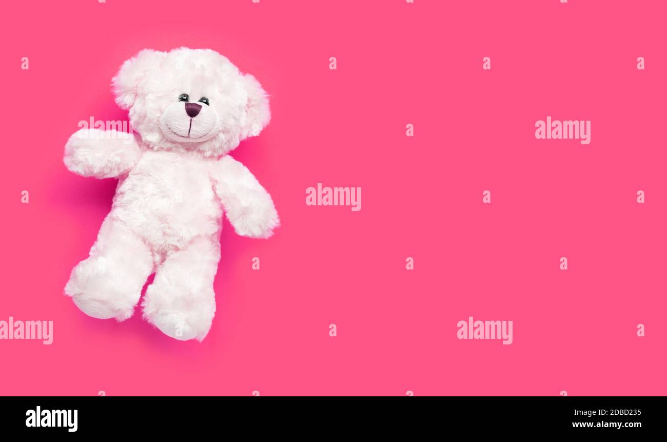 Toy white bear on pink background. Copy space Stock Photo