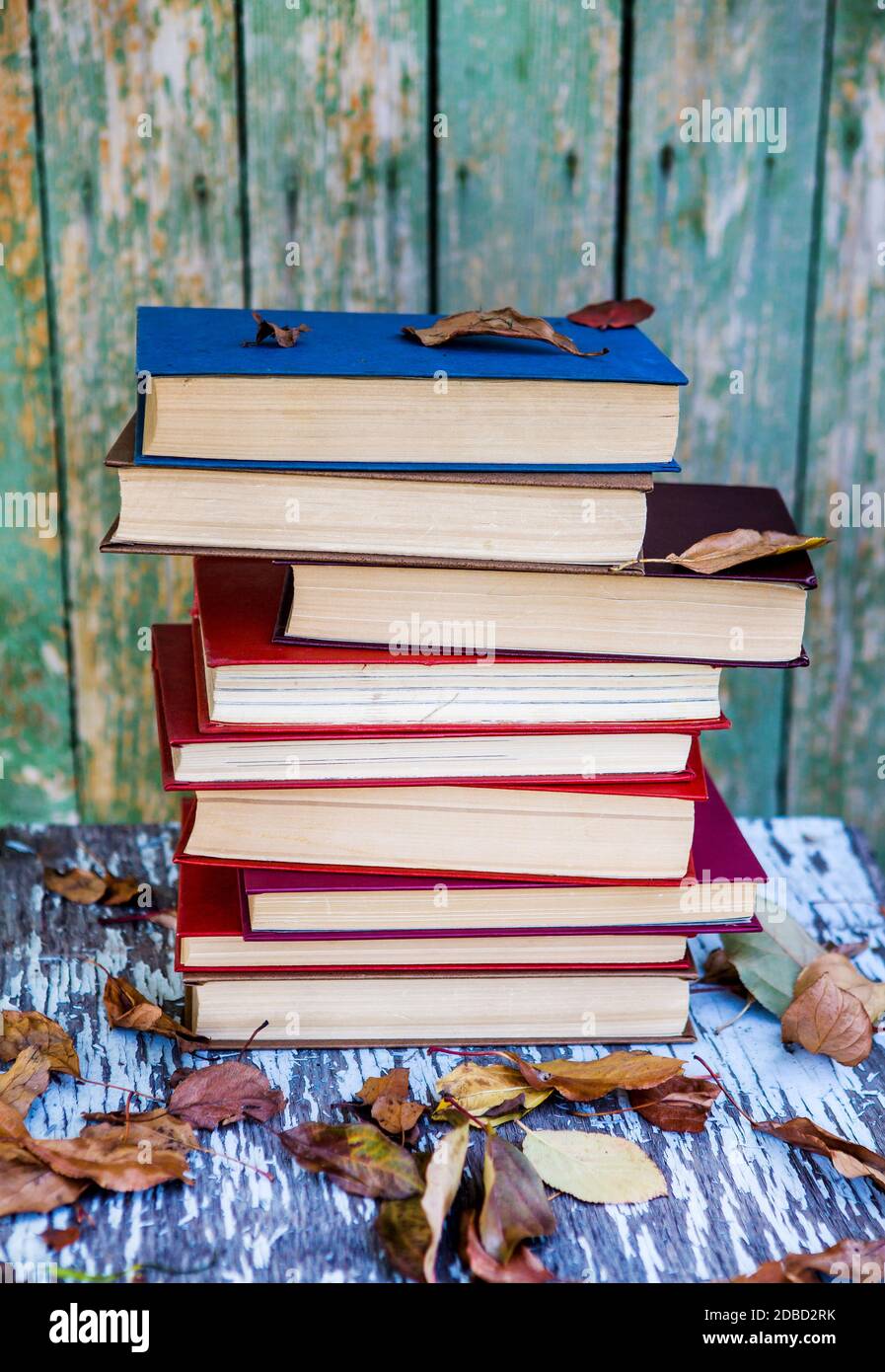 Pile of Books on the Old Table outdoor Stock Photo - Alamy