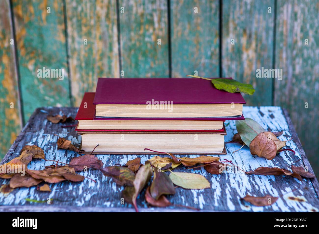 Pile of Books on the Old Table outdoor Stock Photo - Alamy
