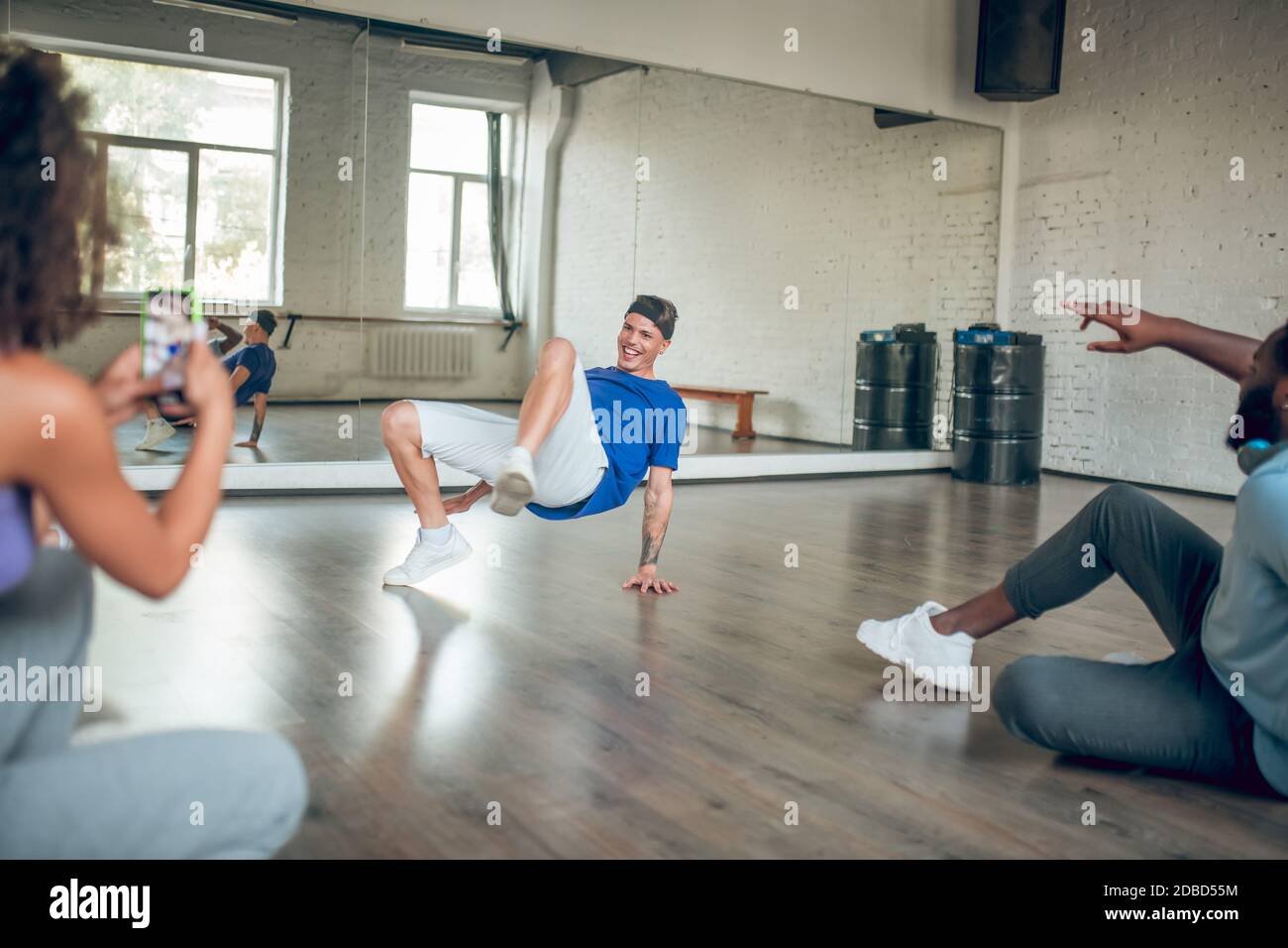 Trainer teaches his students to do a breaking choreography Stock Photo