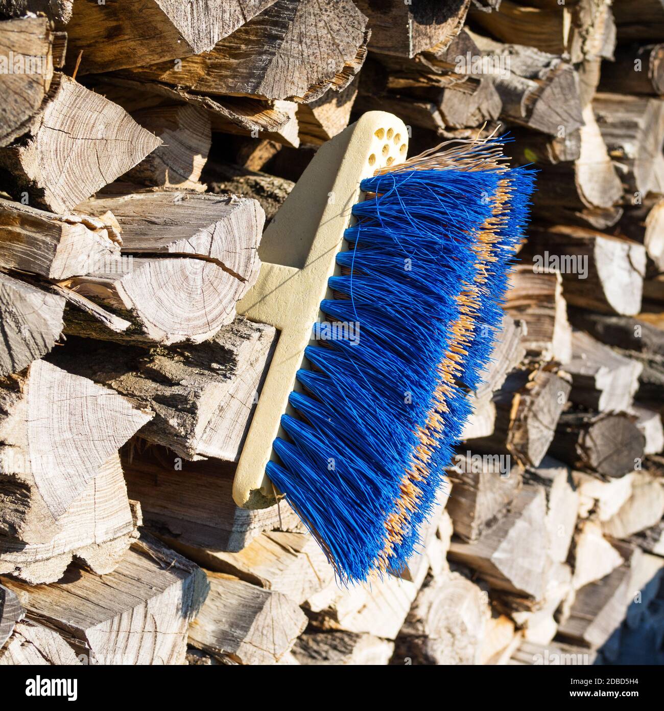 Broom Stack old broom at s stack of wood Stock Photo - Alamy