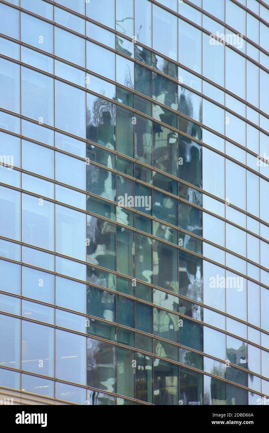 Conceptual view in the financial square of Milan: reflection of the vertical forest into Windows of Unicredit skycraper.hires. Stock Photo