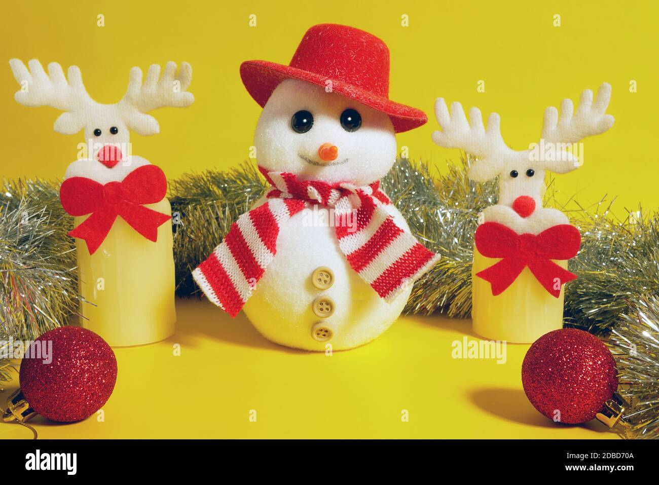 Christmas composition made of snowman in red hat and scarf, two deer ...