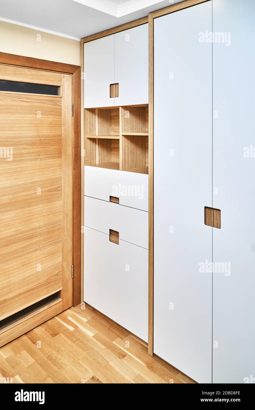 Modern wooden wardrobe with flat finger pull wardrobe doors. Oak ...