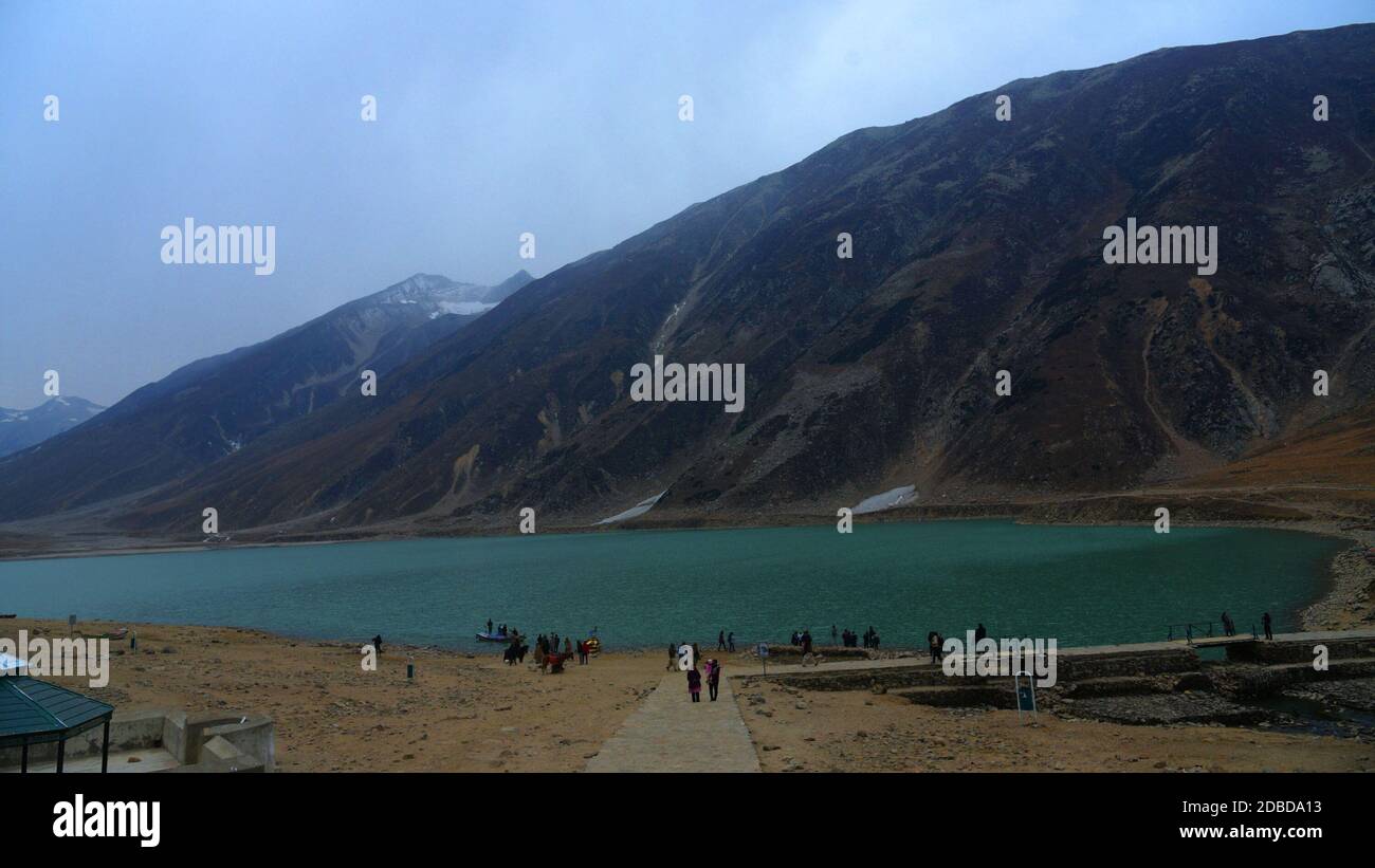 An attractive beautiful mesmerizing view of the Lake Saif Ul Malook located about 8 kilometers (5 miles) north from the town of Naran in northern end of Kaghan Valley, in District Mansehra, Khyber Pakhtunkhwa. Lake Saif ul Malook is a famous tourist resort, well known for the associated story of a Persian prince Saif ul Malook. It is located about 8 kilometers (5 miles) north from the town of Naran in northern end of Kaghan Valley, in District Mansehra, Khyber Pakhtunkhwa. The lake with its majestic and mesmerizing natural beauty, pleasant atmosphere and associated tale and history, attracts t Stock Photo