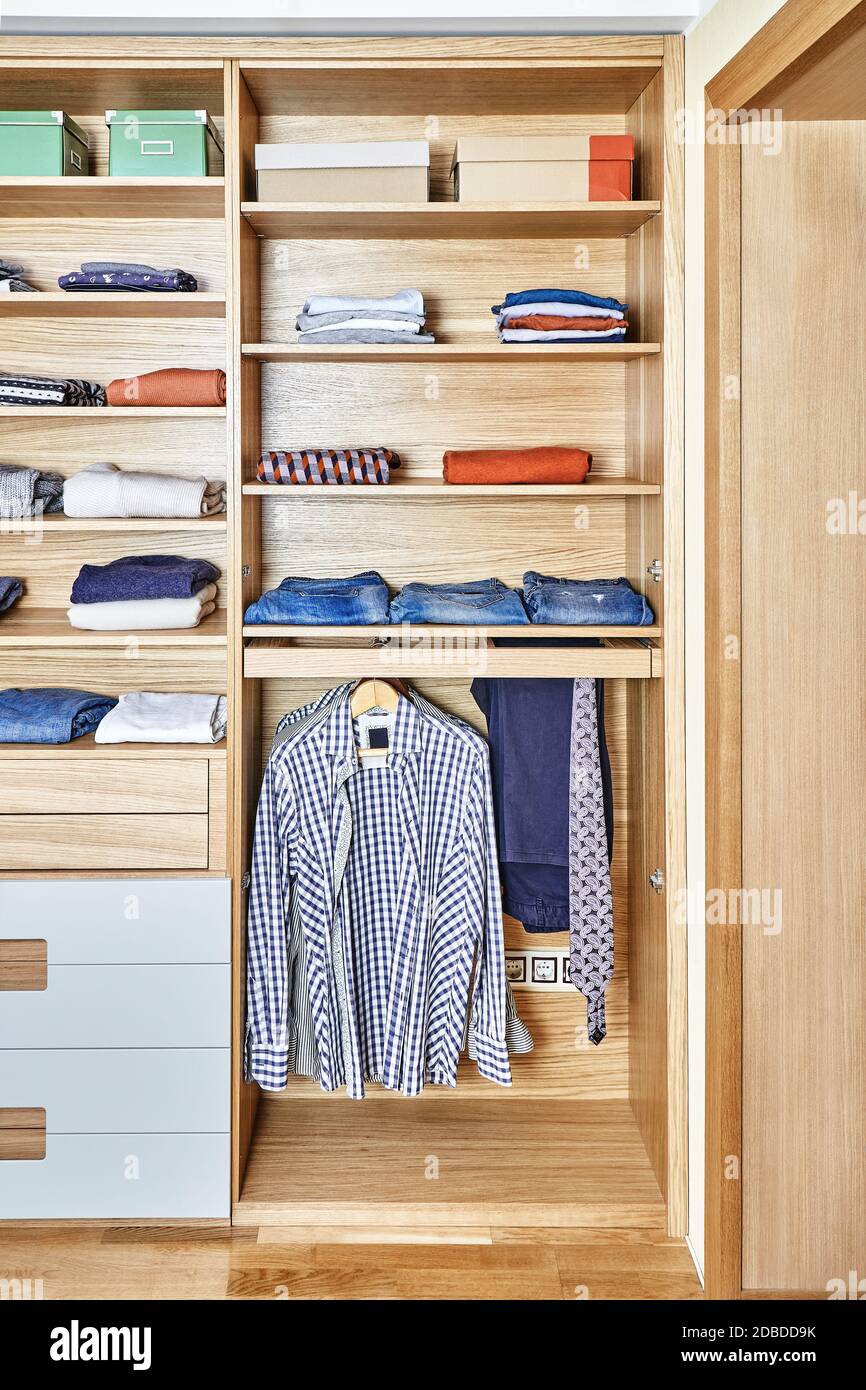 Internal details of the wooden wardrobe with slide out rack for