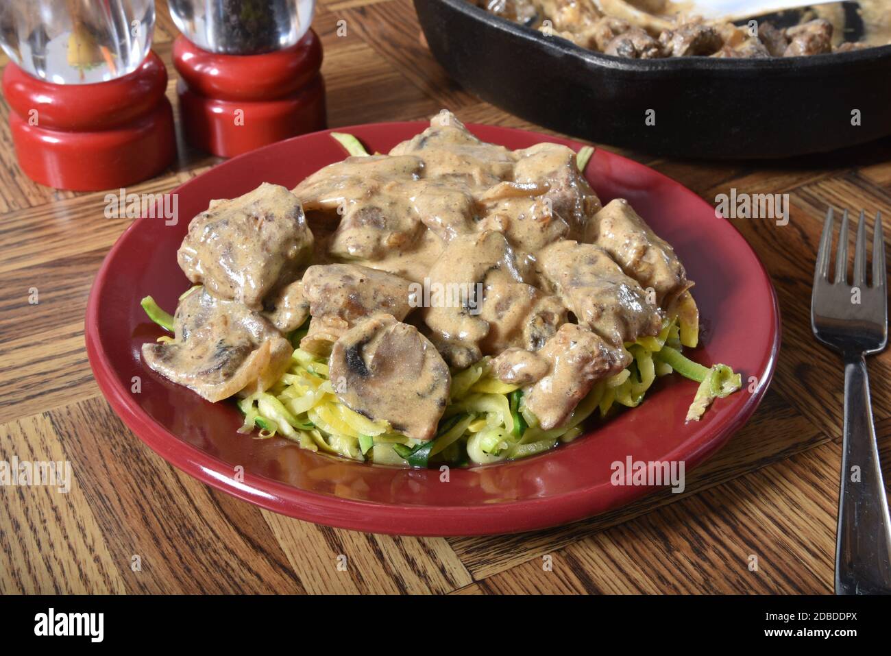 Beef stroganoff served on zucchini noodles Stock Photo Alamy
