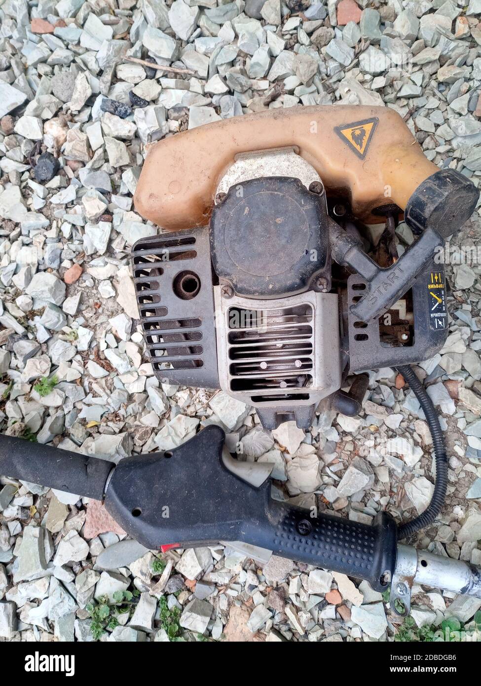 Parts from broken motos. Petrol trimmer disassembled. Stock Photo